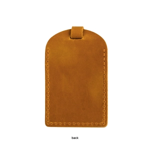 Detail view of the back of a vintage crazy horse leather luggage tag with fine stitching
