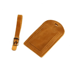 Vintage brown crazy horse leather luggage tag with adjustable buckle strap and stitching