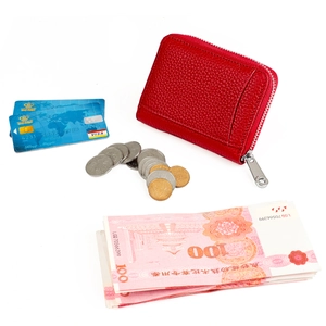 Macro detail of red lychee grain leather wallet with RFID card slot and zipper