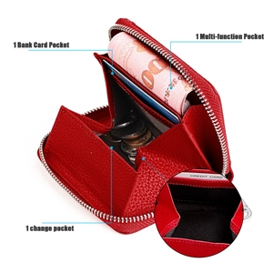 Detail of red RFID leather wallet showing bank card slots and metal zipper pocket