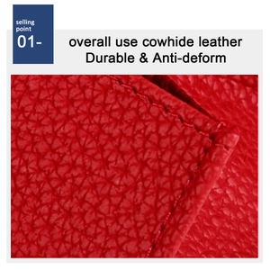 Detail of red cowhide leather grain and reinforced stitching on a durable RFID wallet