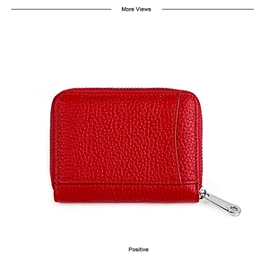 Detail of red genuine leather card holder with litchi texture and silver zipper