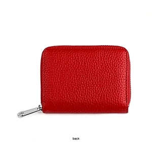 Macro shot of red pebble grain leather coin purse with silver zipper and back view detail