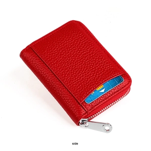 Detail view of red lychee grain leather RFID wallet featuring card slot and silver zipper