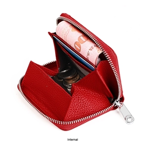 Detail view of red lychee grain leather wallet with RFID blocking and interior card slots