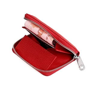 Detail showing red pebble leather coin purse with silver zipper and card slots