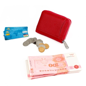 Red lychee grain leather RFID coin purse showing interior capacity with cards and cash