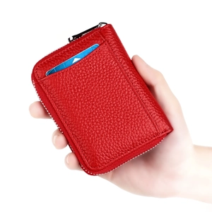 Close-up of red pebbled leather RFID wallet with card slot and metal zipper detail