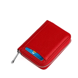 Close-up of red lychee pattern leather wallet with external card slot and metal zipper