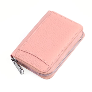 Close-up of pink leather RFID wallet showing lychee grain texture and metal zipper