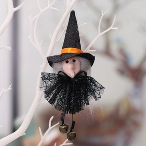 Hanging Halloween witch doll with black lace dress and bells on white tree branch