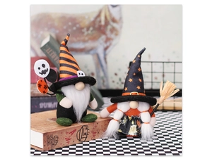 Detail of Halloween gnome figurines with striped wizard hats and broom on a checkered table