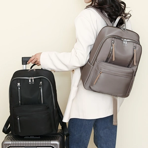 Large capacity nylon travel backpacks for women in brown and black with multiple pockets