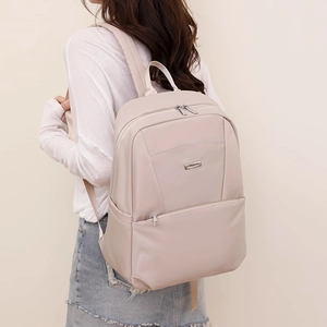 Minimalist beige nylon backpack with large capacity and adjustable straps for daily travel