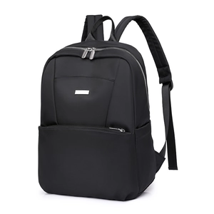 Detail view of the black nylon backpack showing smooth zipper pockets and a small metal logo