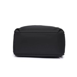 Detailed view of the reinforced rectangular base on this black fabric backpack
