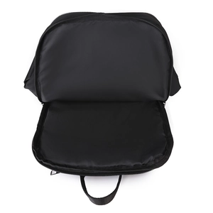 Top view of spacious internal compartment and black lining of the nylon travel backpack