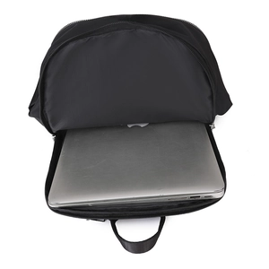 Top view of spacious main compartment showing a laptop stored in the black backpack
