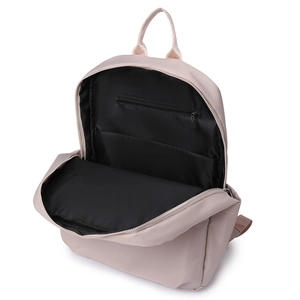 Detailed interior of pink backpack featuring spacious main compartment and zipper pocket