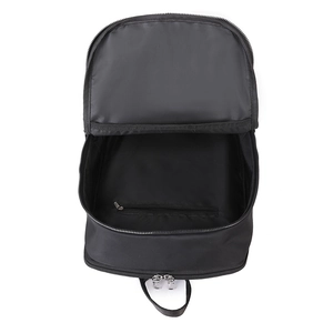 Interior detail of black travel backpack showing spacious main compartment and zip pocket.