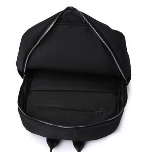 Interior view of black backpack showing laptop compartment and inner zipper pocket