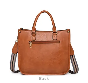 Détail arrière du sac à main en similicuir marron avec poche zippée et bandoulière