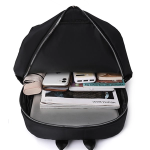 Internal view of the large capacity nylon backpack showing space for a laptop and books