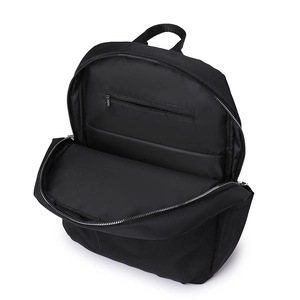 Internal view of black laptop backpack showing padded compartments and spacious storage