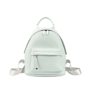 Detailed macro view of mint green pebble leather texture and front zipper pocket