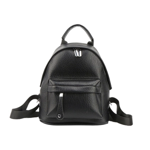 Detail of black pebbled PU leather mini backpack showing top handle and zippered front pocket