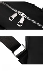 Détails des fermetures éclair doubles en métal et des fixations de sangle sur le sac à dos