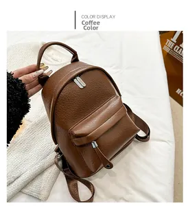 Detail view of coffee brown PU leather mini backpack with pebble texture and adjustable straps