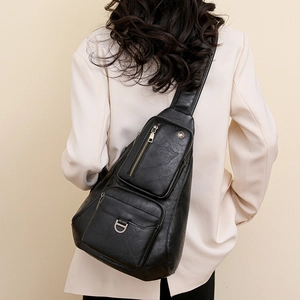 Versatile black leather crossbody chest bag for women with multiple zipper pockets