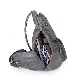 Detail of dark grey vintage PU bag showing large capacity and multiple zipper pockets