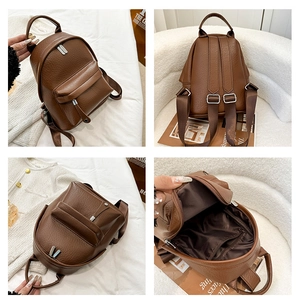 Brown lychee grain PU backpack with multi-compartment design and silver metal hardware