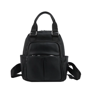 Detailed view of black litchi texture PU leather backpack with silver zippers and top handle