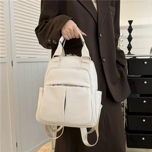 Fashionable cream white PU leather backpack for women featuring multiple pocket compartments