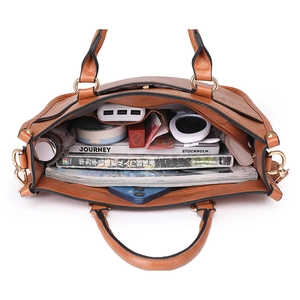 Brown leather tote bag with large capacity interior compartments for books and gadgets