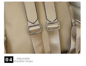 Detail of adjustable shoulder strap on beige pebbled leather backpack with silver buckle