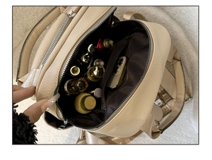 Detail view of the spacious interior compartment showing pockets and storage capacity