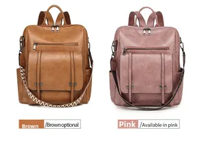 Detail view of large PU leather backpacks in brown and pink with woven straps