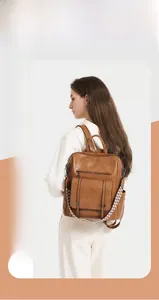 Detailed view of brown PU leather backpack with wide geometric patterned woven strap