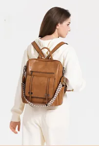 Brown PU leather backpack with vintage design and geometric patterned shoulder strap