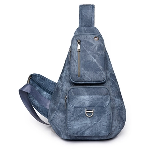 Retro blue washed denim crossbody sling bag with multiple zippers and earphone port