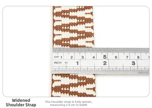 Close-up of 3.8cm wide woven shoulder strap with brown and white geometric patterns