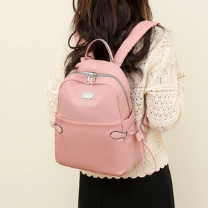 Rosafarbener Oxford-Rucksack für Damen mit leichtem Design und silbernen Reißverschlüssen