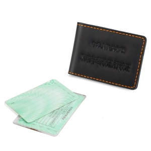 Detail of black leather driver license wallet with striking yellow contrast stitching