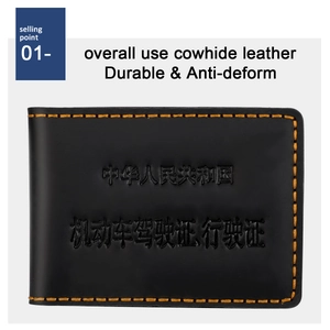 Macro shot of durable black leather driver license cover with embossed text and yellow stitching