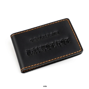Side view of black leather driver's license holder with orange contrast stitching detail