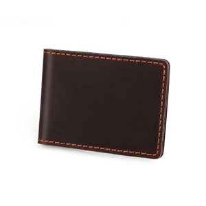 Detailed view of vintage dark brown leather driving license holder with orange stitching